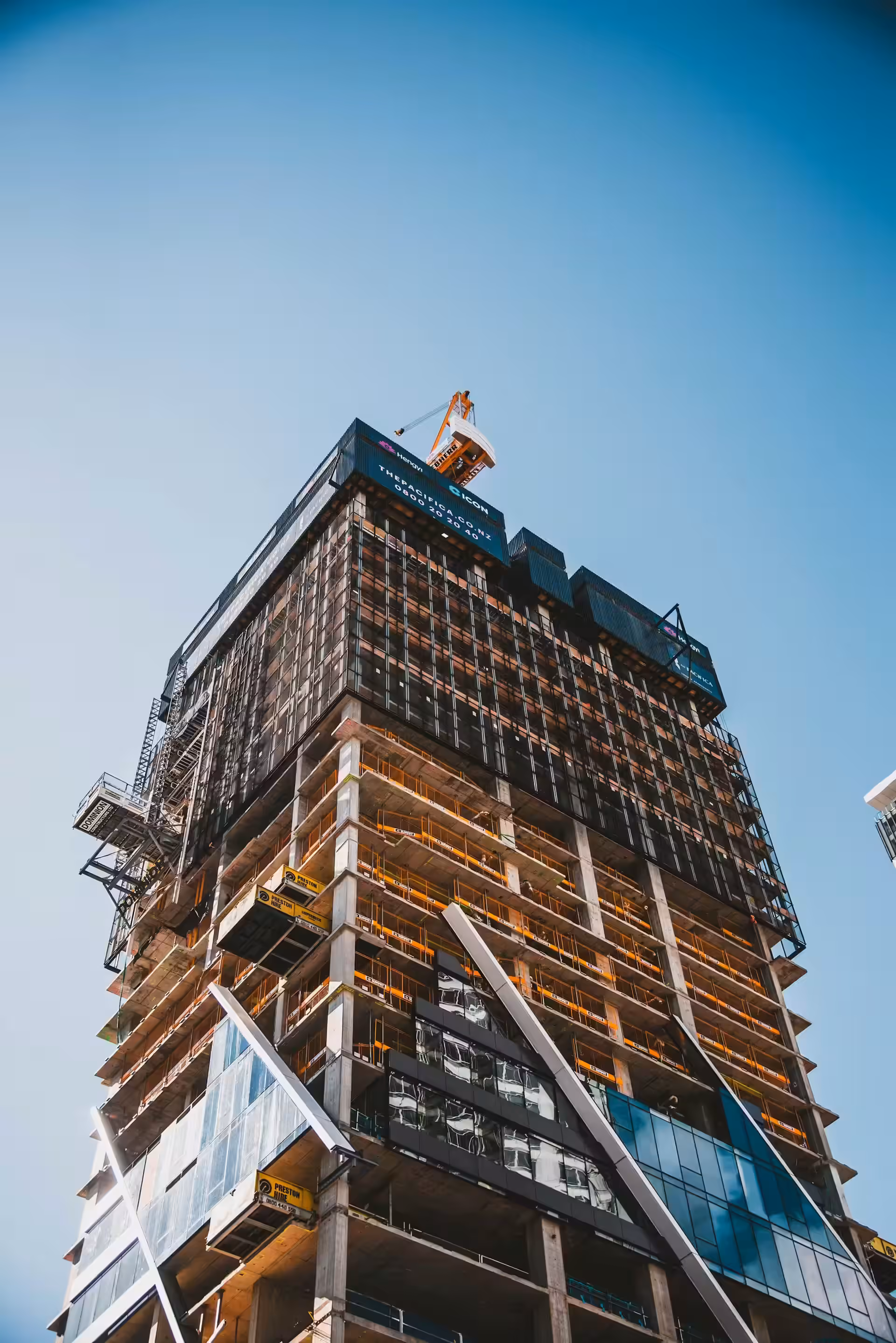 Brown and gray building under construction